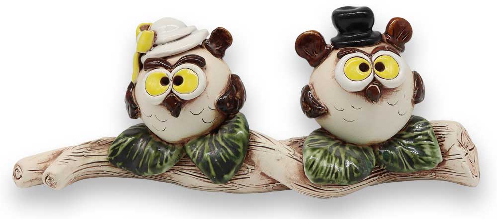 Couple of owls on trunk