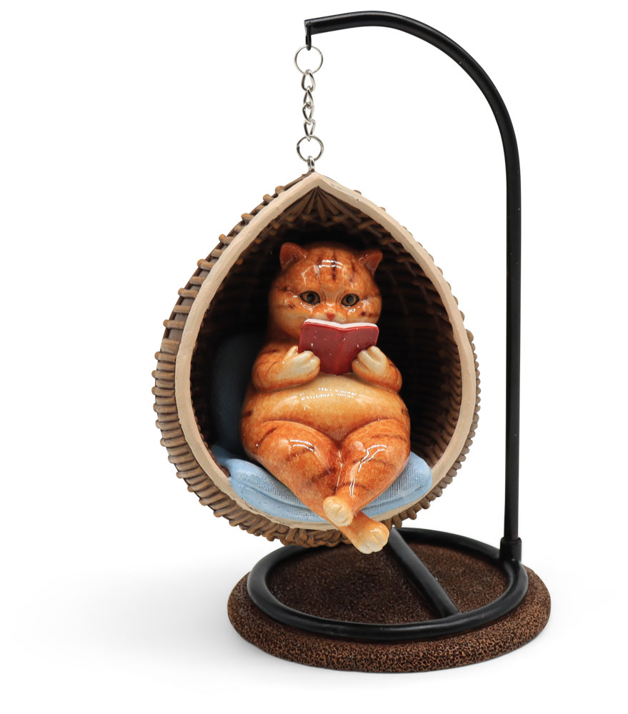 Mr. Felix in a rocking chair, polyresin